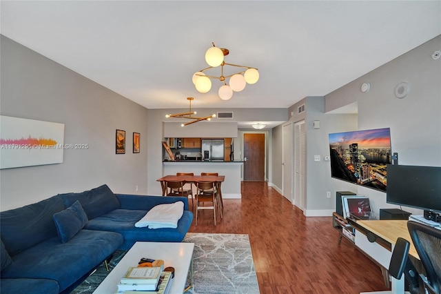 31 SE 5th St Unit 1505, Miami, FL 33131 - living area featuring baseboards, a chandelier, visible vents, and wood finished floors