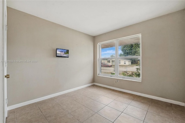 3460 NW 17th St, Lauderhill, FL 33311 - empty room featuring baseboards and light tile patterned flooring