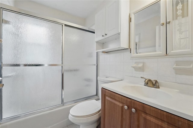 3460 NW 17th St, Lauderhill, FL 33311 - bathroom with combined bath / shower with glass door, toilet, decorative backsplash, and vanity