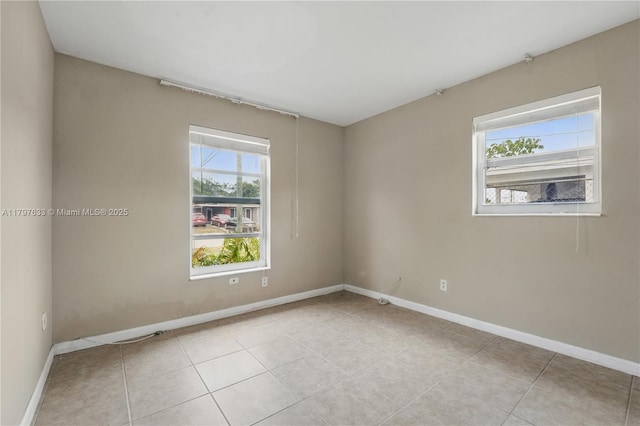 3460 NW 17th St, Lauderhill, FL 33311 - spare room with baseboards and light tile patterned flooring