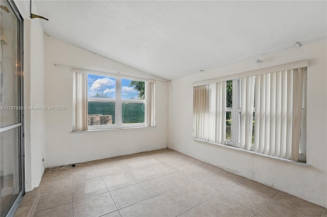 3460 NW 17th St, Lauderhill, FL 33311 - tiled spare room featuring lofted ceiling
