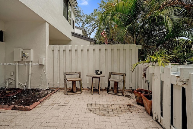view of patio / terrace featuring fence