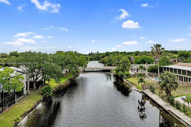 property view of water featuring fence