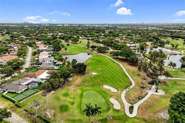 birds eye view of property featuring a water view, a residential view, and view of golf course