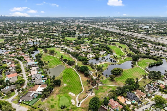 birds eye view of property with a water view, golf course view, and a residential view