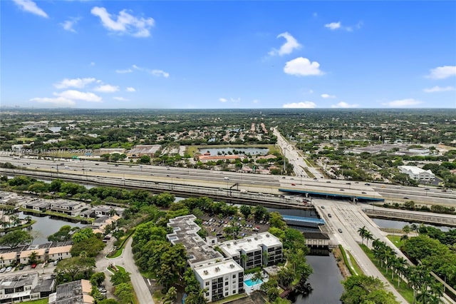 birds eye view of property with a water view and a residential view