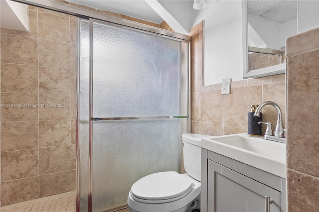 34 NW 34th Ter, Miami, FL 33127 - bathroom with a shower stall, tile walls, toilet, and vanity