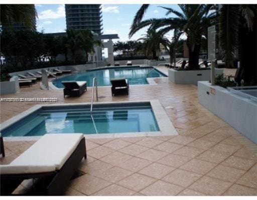 community pool featuring a patio