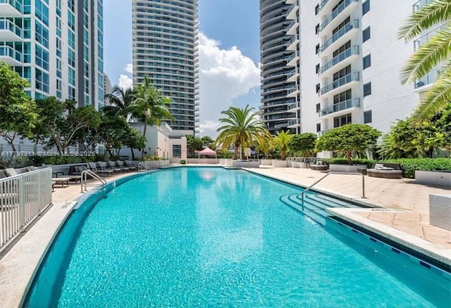 community pool featuring a patio area