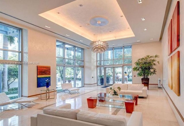 community lobby featuring a high ceiling and recessed lighting