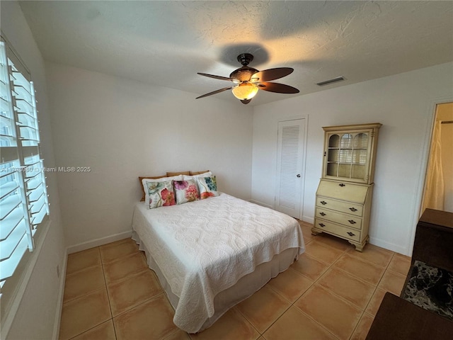 1700 Pierce St Unit 202, Hollywood, FL 33020 - bedroom with light tile patterned flooring, baseboards, and ceiling fan
