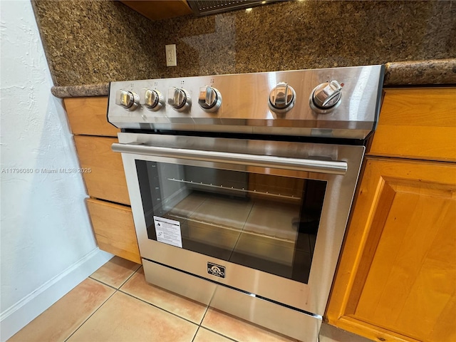 1700 Pierce St Unit 202, Hollywood, FL 33020 - kitchen view of stainless steel range and baseboards