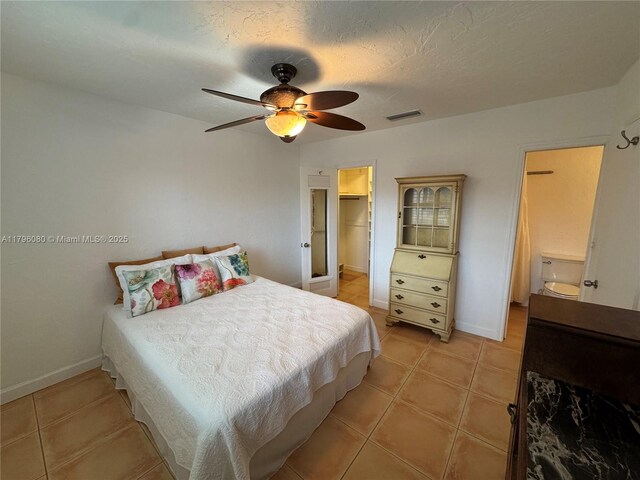 1700 Pierce St Unit 202, Hollywood, FL 33020 - bedroom featuring light tile patterned flooring, a walk in closet, and baseboards