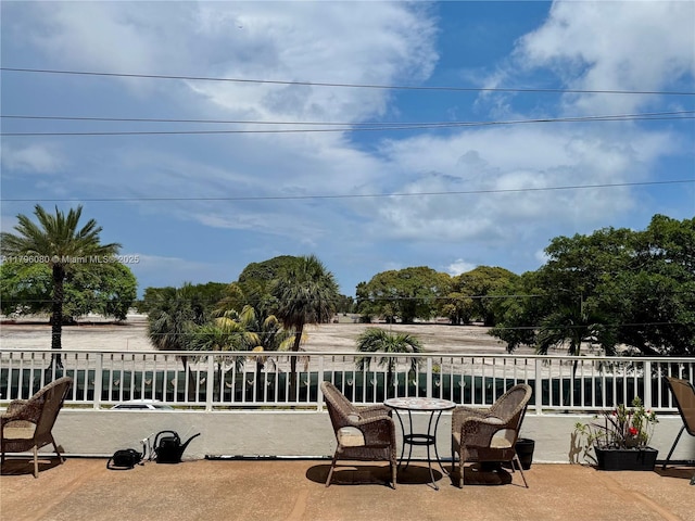 view of patio featuring a balcony