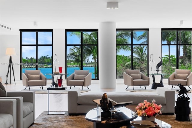 7025 Fisher Island Dr Unit 7025, Miami Beach, FL 33109 - living area featuring healthy amount of natural light and a water view