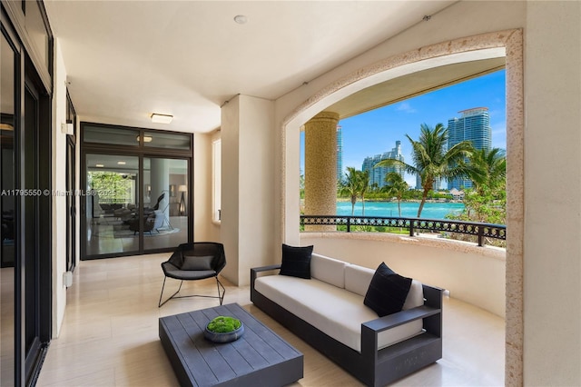 7025 Fisher Island Dr Unit 7025, Miami Beach, FL 33109 - view of patio / terrace with a balcony, outdoor lounge area, and a view of city