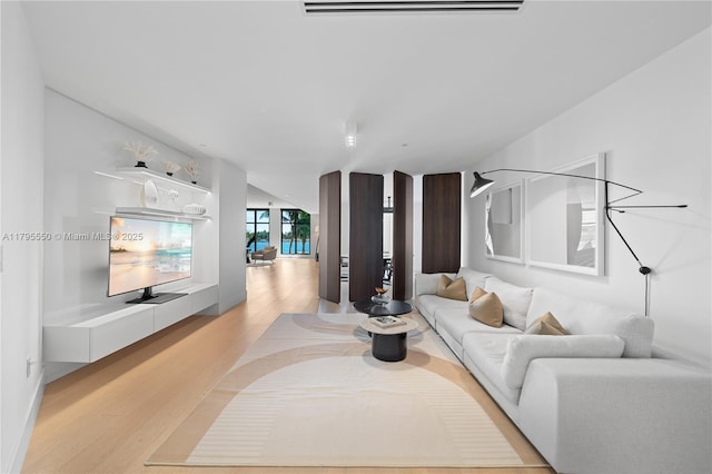 7025 Fisher Island Dr Unit 7025, Miami Beach, FL 33109 - living room featuring light wood finished floors