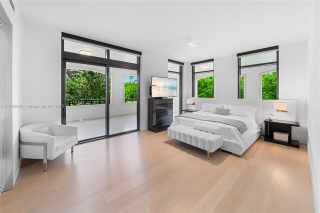 7025 Fisher Island Dr Unit 7025, Miami Beach, FL 33109 - bedroom featuring access to outside and light wood-style floors