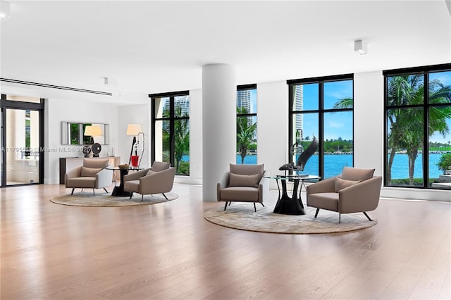 7025 Fisher Island Dr Unit 7025, Miami Beach, FL 33109 - common area with floor to ceiling windows and a water view