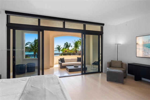 7025 Fisher Island Dr Unit 7025, Miami Beach, FL 33109 - bedroom with wood finished floors and access to outside