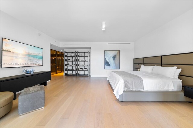 7025 Fisher Island Dr Unit 7025, Miami Beach, FL 33109 - bedroom featuring wood finished floors