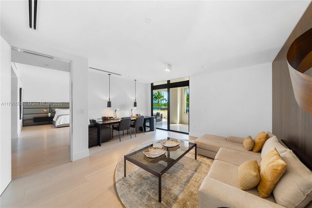 7025 Fisher Island Dr Unit 7025, Miami Beach, FL 33109 - living area featuring light wood-style flooring and a desk