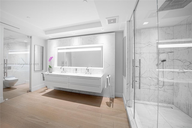 7025 Fisher Island Dr Unit 7025, Miami Beach, FL 33109 - bathroom with a marble finish shower, double vanity, a raised ceiling, toilet, and wood finished floors