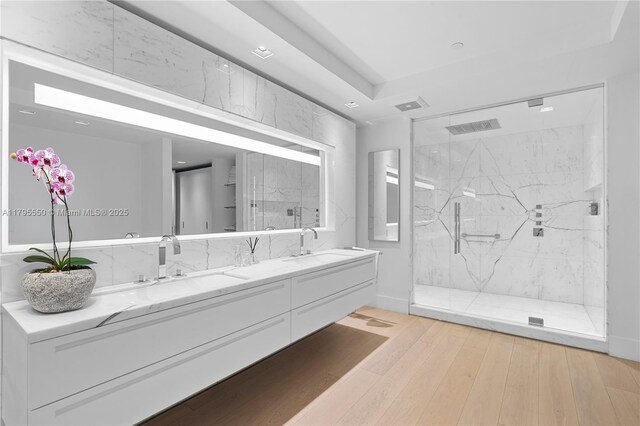 7025 Fisher Island Dr Unit 7025, Miami Beach, FL 33109 - full bath featuring double vanity, a marble finish shower, and wood finished floors