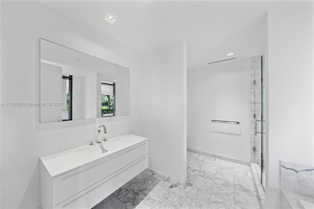 7025 Fisher Island Dr Unit 7025, Miami Beach, FL 33109 - bathroom with marble finish floors, vanity, baseboards, and a marble finish shower
