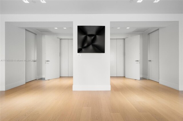 7025 Fisher Island Dr Unit 7025, Miami Beach, FL 33109 - empty room with light wood-style floors, baseboards, and recessed lighting