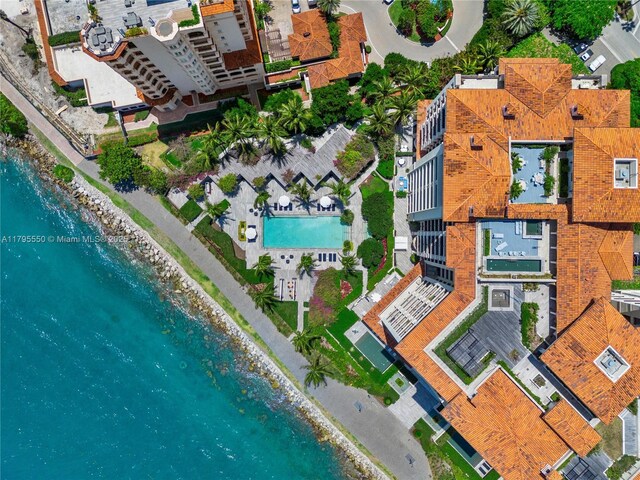 7025 Fisher Island Dr Unit 7025, Miami Beach, FL 33109 - drone / aerial view of waterfront with a beach and a pool area