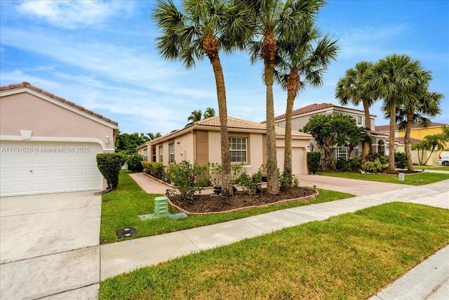 view of front of house with concrete driveway, stucco siding, a front lawn, and an attached garage