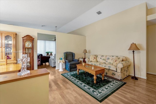 15773 NW 16th Ct, Pembroke Pines, FL 33028 - living area featuring light wood-style flooring, lofted ceiling, and baseboards