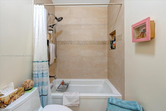 full bath featuring toilet and shower / bath combination with curtain