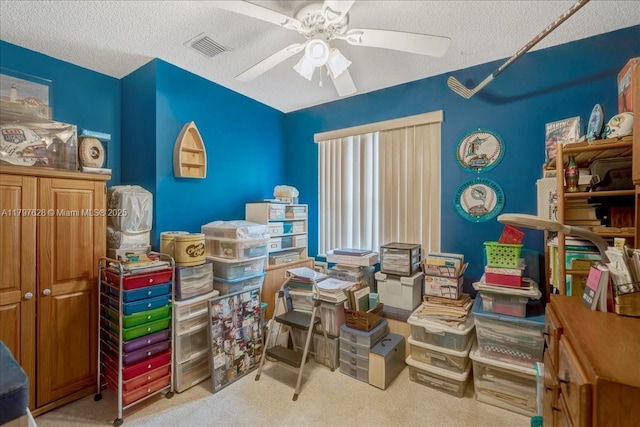 storage area with visible vents and ceiling fan
