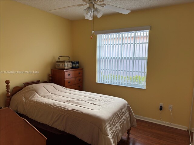 15773 NW 16th Ct, Pembroke Pines, FL 33028 - bedroom with wood finished floors, baseboards, a textured ceiling, and ceiling fan