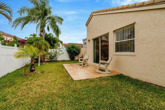 view of yard featuring a fenced backyard and a patio