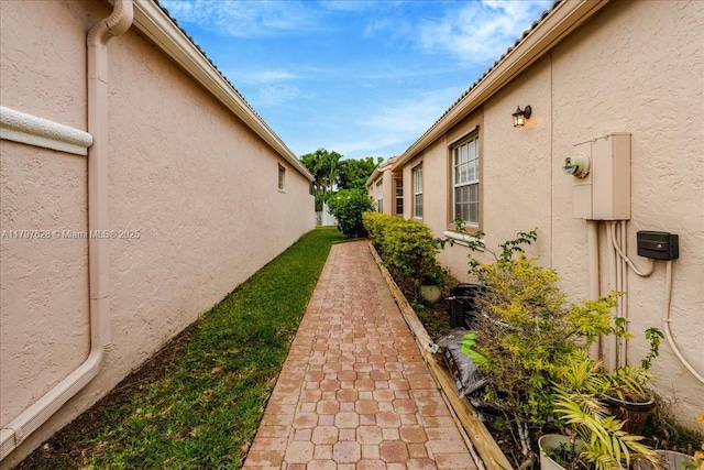 view of side of property with stucco siding