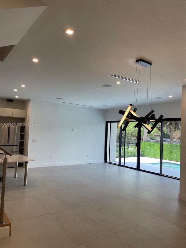 interior space with a wealth of natural light, baseboards, and recessed lighting