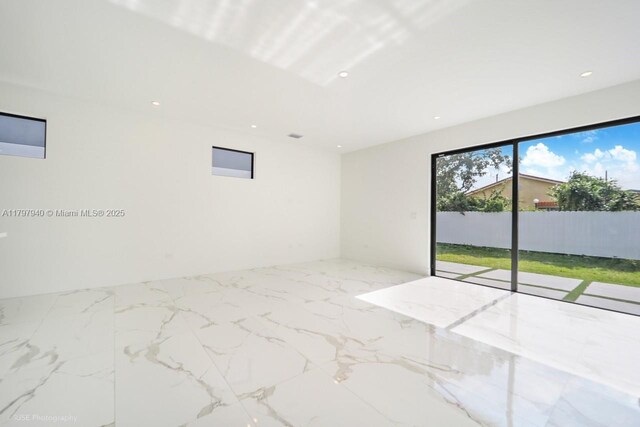 2330 SW 14th St, Miami, FL 33145 - empty room featuring marble finish floor and recessed lighting