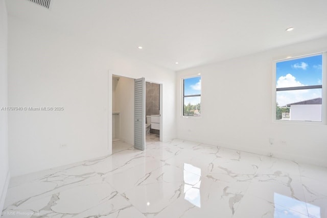 2330 SW 14th St, Miami, FL 33145 - unfurnished bedroom with ensuite bathroom, visible vents, marble finish floor, and recessed lighting