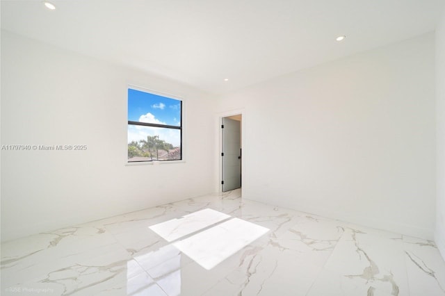 2330 SW 14th St, Miami, FL 33145 - empty room with marble finish floor and recessed lighting