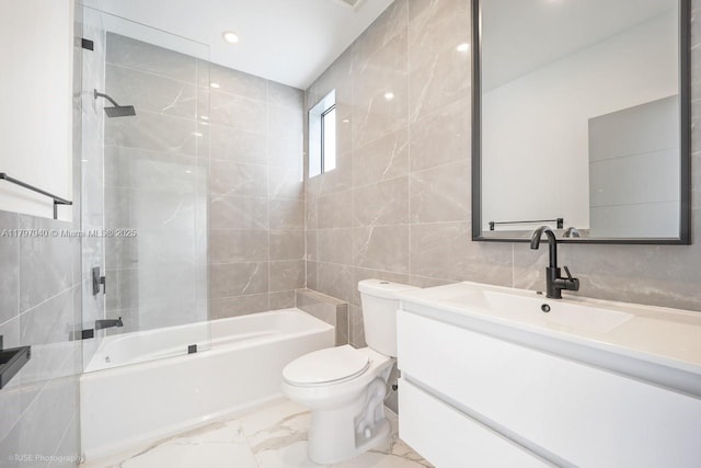 2330 SW 14th St, Miami, FL 33145 - bathroom with tile walls, shower / bathtub combination, toilet, marble finish floor, and vanity