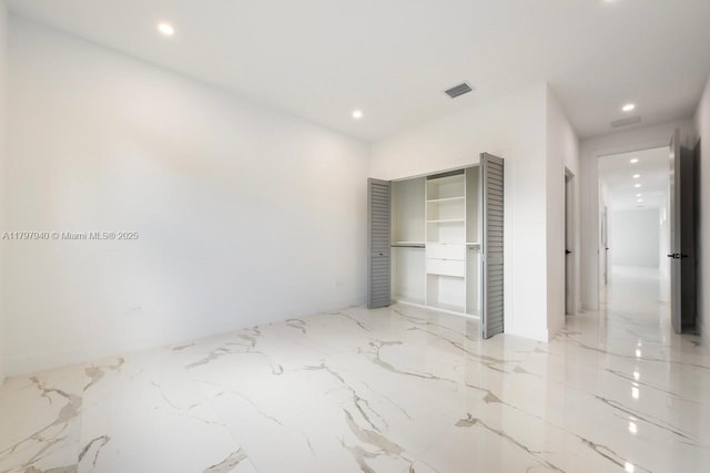 2330 SW 14th St, Miami, FL 33145 - unfurnished bedroom with a closet, visible vents, marble finish floor, and recessed lighting