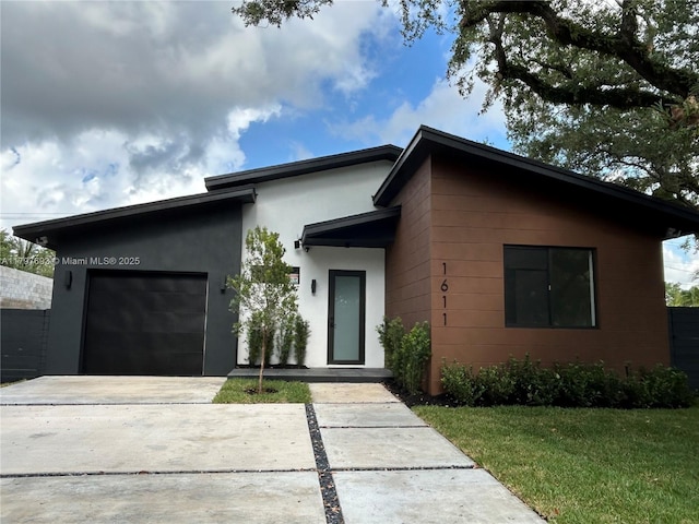 1611 SW 30th Ave, Fort Lauderdale, FL 33312 - contemporary home featuring driveway, stucco siding, a garage, and a front yard
