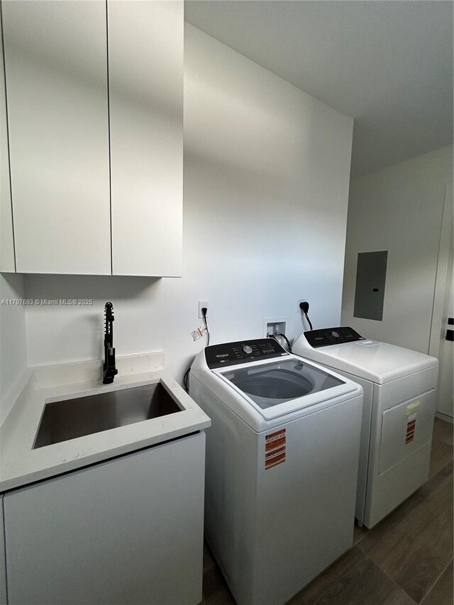 1611 SW 30th Ave, Fort Lauderdale, FL 33312 - laundry room featuring independent washer and dryer, dark wood finished floors, a sink, electric panel, and cabinet space