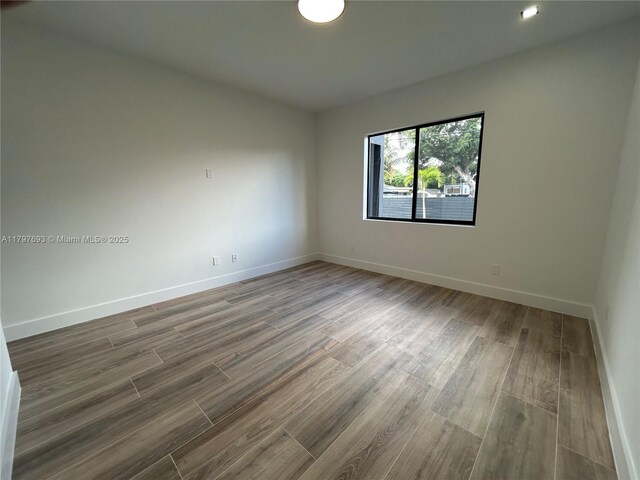 1611 SW 30th Ave, Fort Lauderdale, FL 33312 - spare room featuring baseboards and wood finished floors