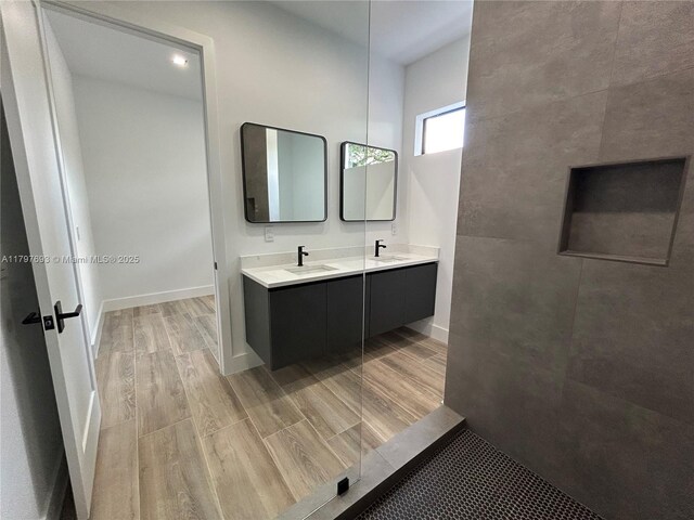 1611 SW 30th Ave, Fort Lauderdale, FL 33312 - full bathroom with double vanity, wood finished floors, and a sink
