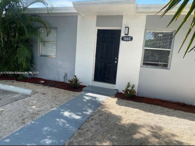 1860 NW 59th St, Miami, FL 33142 - view of exterior entry with stucco siding