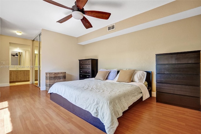 9136A SW 20th Pl, Davie, FL 33324 - bedroom featuring wood finished floors, baseboards, ensuite bath, and a ceiling fan